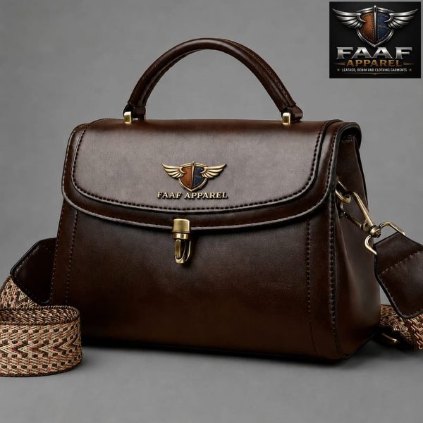 brown faux leather handbag featuring a winged emblem and a gold-toned front clasp closure.